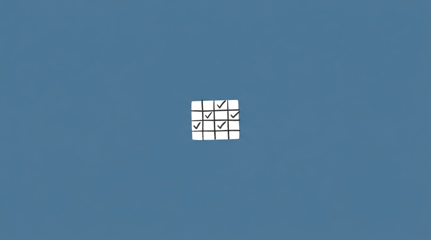 Hand-drawn illustration of a small grid with check marks